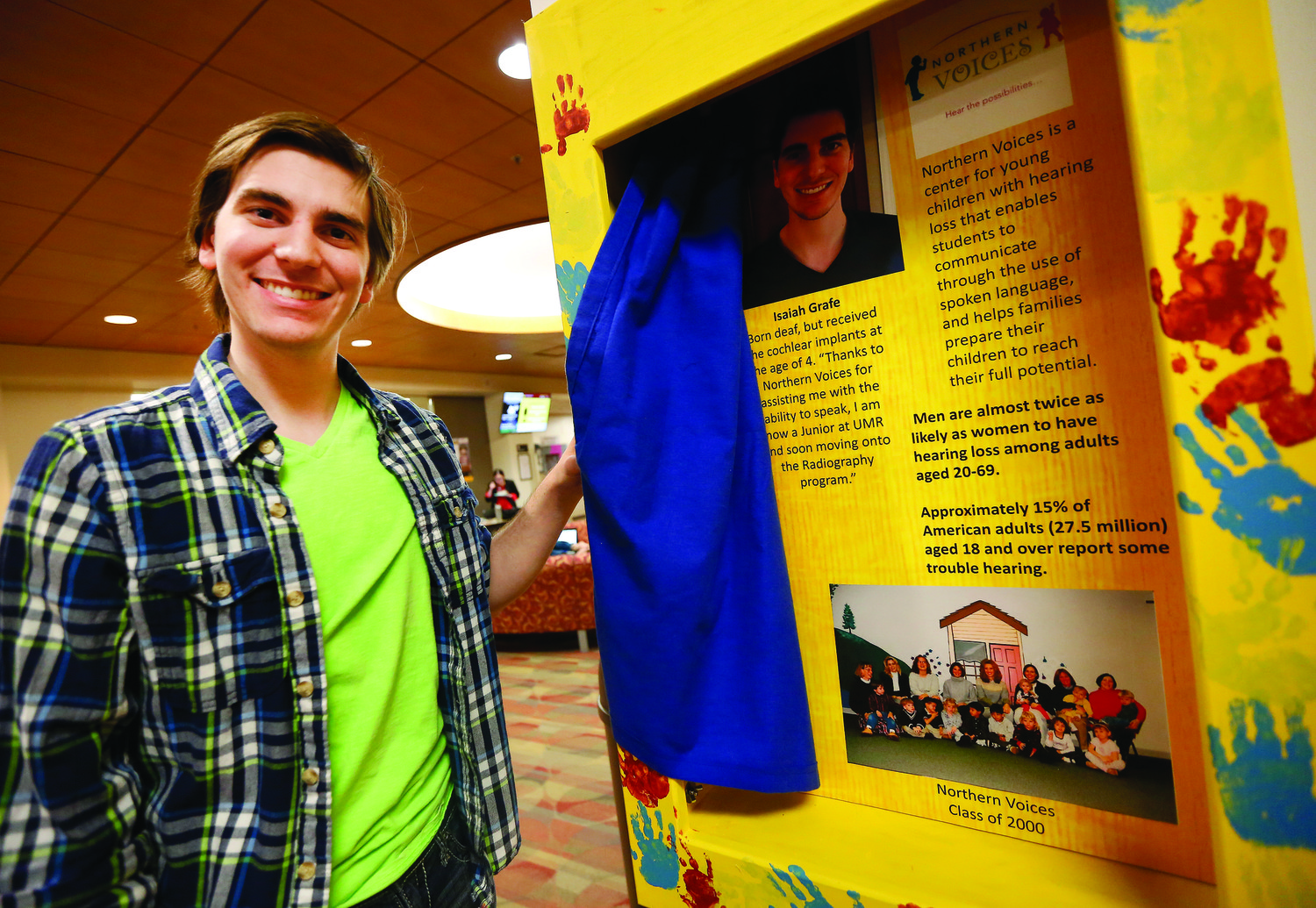 Isaiah Grafe with the box he created about living with a hearing impairment